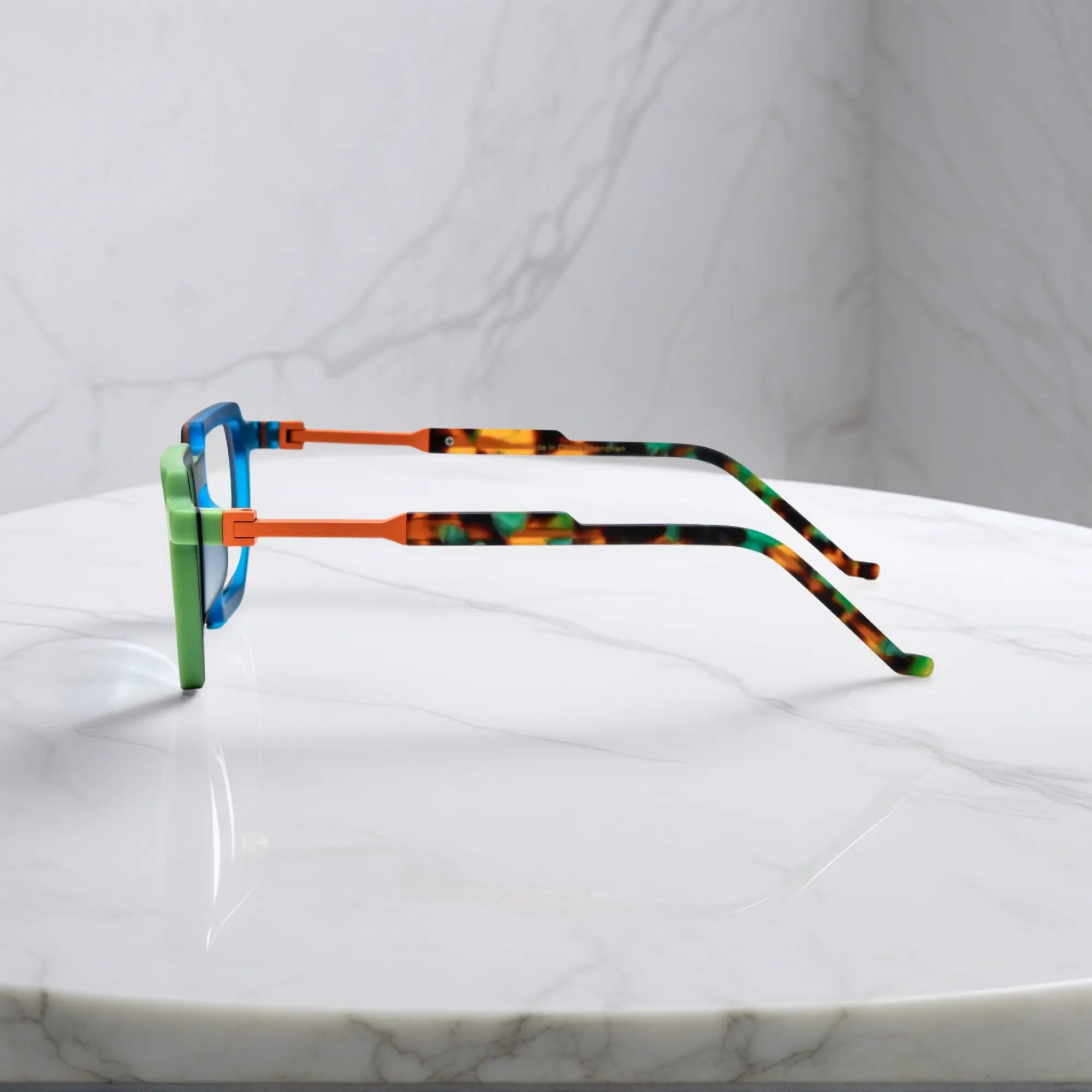 Side view showing dual-tone blue-green acetate temples and artistic geometric design by VoyueLens™